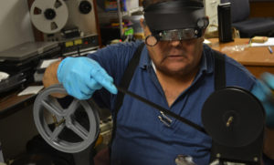 Conservator inspecting movies